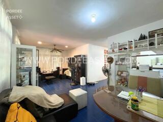 Main living area with blue tiled floor and modern furnishings