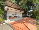 Outdoor patio with a covered area and ample open space