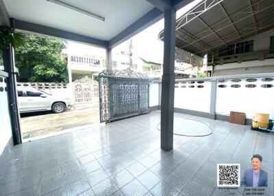 Covered garage with tiled flooring