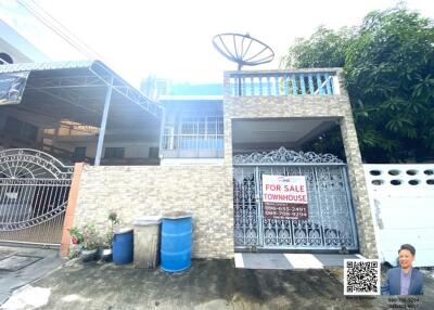 Facade of a townhouse for sale