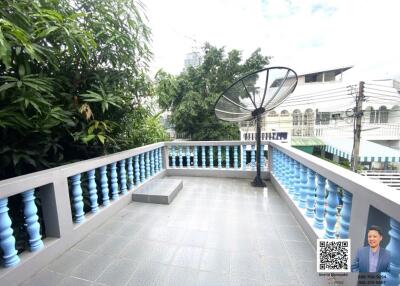 Outdoor balcony with tiled flooring and satellite dish