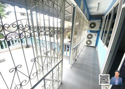 Balcony with air conditioning units and decorative railings