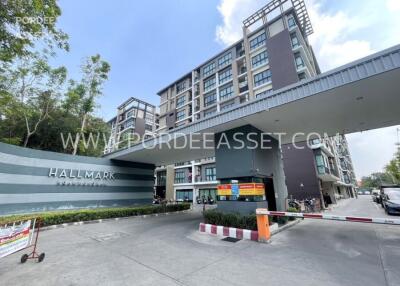 Entrance of a modern residential building with signage