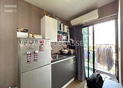 Modern kitchen with appliances and balcony