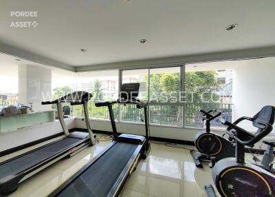 Well-equipped gym with treadmills and exercise bikes in a modern building