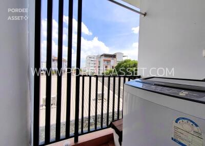 View from balcony featuring washing machine