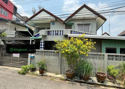 Exterior view of a house with a fence and driveway