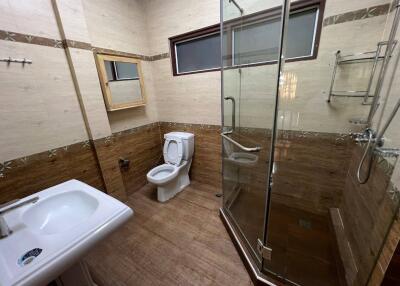 Bathroom with glass shower and toilet