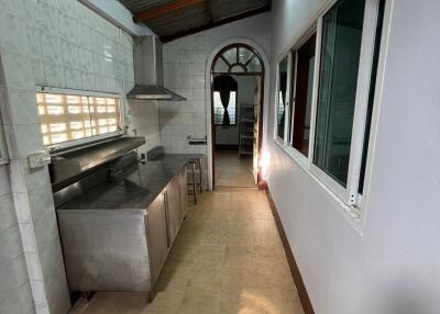 Simple kitchen with stainless steel appliances and large window