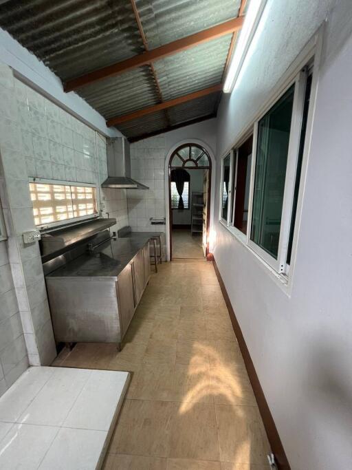 Simple kitchen with stainless steel appliances and large window