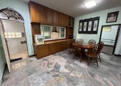 Cozy kitchen with wooden cabinets and dining area