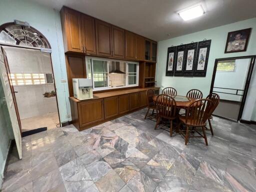 Cozy kitchen with wooden cabinets and dining area