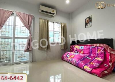 Living room with air conditioning and colorful sofa