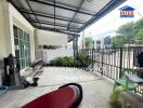 Outdoor porch area of a building with surrounding neighborhood view