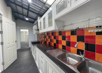 Modern kitchen with colorful backsplash