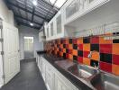 Modern kitchen with colorful backsplash