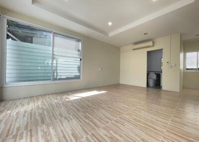 Spacious living area with large windows and natural light