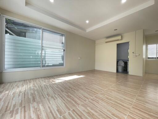 Spacious living area with large windows and natural light