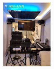 Well-equipped music studio with instruments and equipment