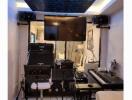 Well-equipped music studio with instruments and equipment