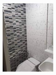 Modern bathroom with tiled walls