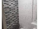 Modern bathroom with tiled walls