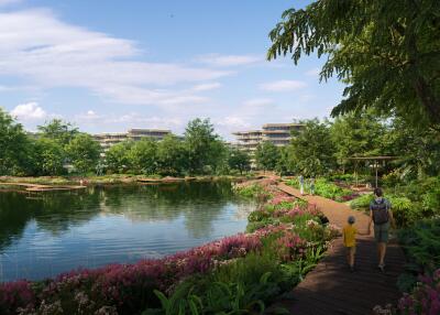 Lakeside walking path in a landscaped garden with people