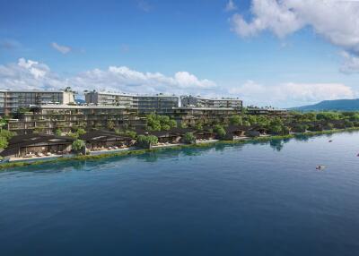 Waterfront view of modern residential complex with lush greenery