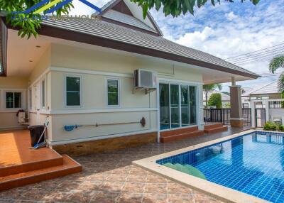 Exterior view of a house with a pool