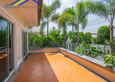 Spacious balcony with greenery and tiled floor