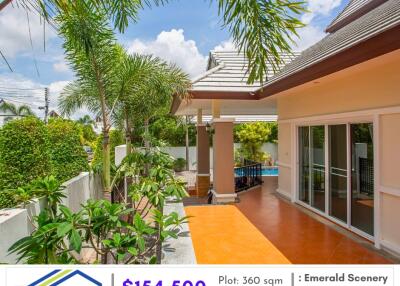 Outdoor view of house with patio and greenery