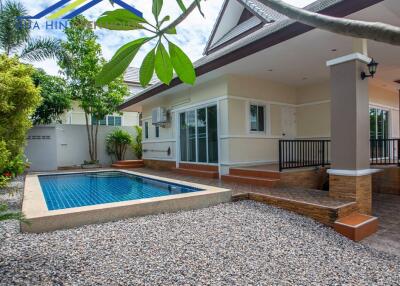 Outdoor area with swimming pool and house