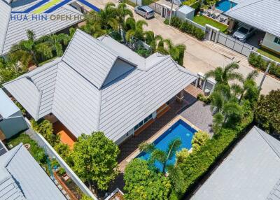 Aerial view of a modern house with a swimming pool