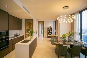 Modern kitchen and dining area in an upscale apartment with stylish fixtures