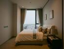 Modern bedroom with a large window and city view