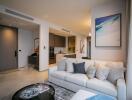 Modern living room with a view into the kitchen