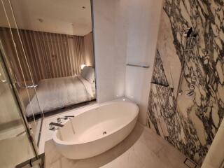 Bathroom with bathtub and shower