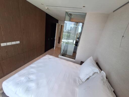 Modern bedroom with a large bed and an en suite bathroom