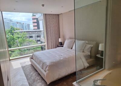 Modern bedroom with large window and view