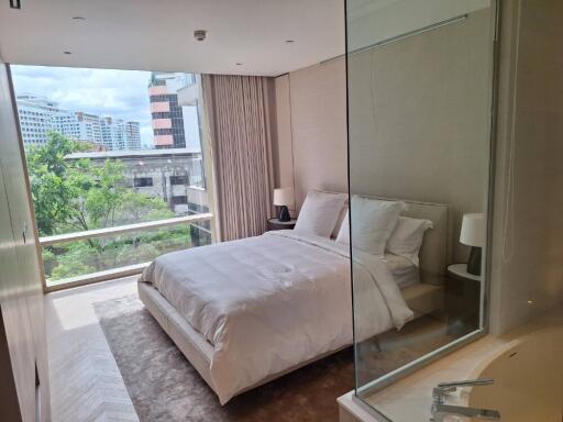 Modern bedroom with large window and view