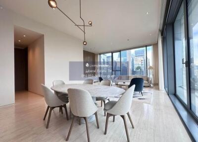 Spacious dining area with large windows and city view