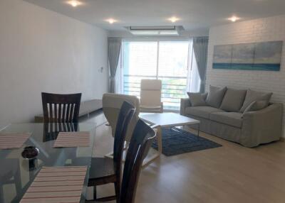 Living room with dining area and large window