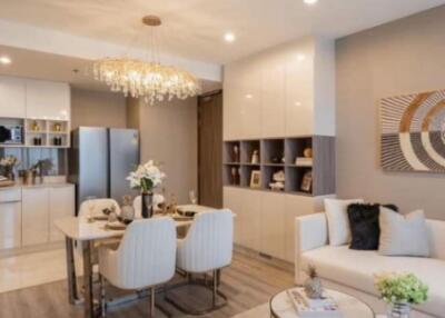 Modern living and dining area with chandelier