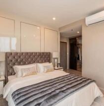 Modern and luxurious bedroom with king-size bed and air conditioning