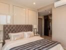 Modern and luxurious bedroom with king-size bed and air conditioning