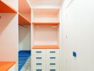 Well-organized closet with vibrant shelves and storage drawers