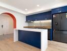 Modern kitchen with blue cabinetry and island