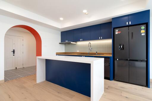 Modern kitchen with blue cabinetry and island