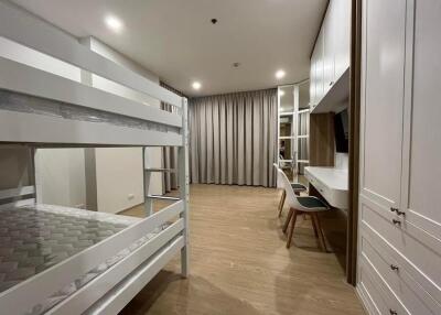 Spacious bedroom with bunk bed and work desk