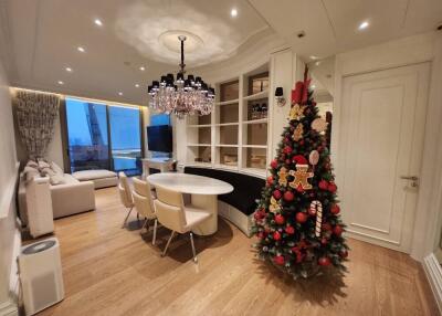 Spacious living room with dining area and decorated Christmas tree